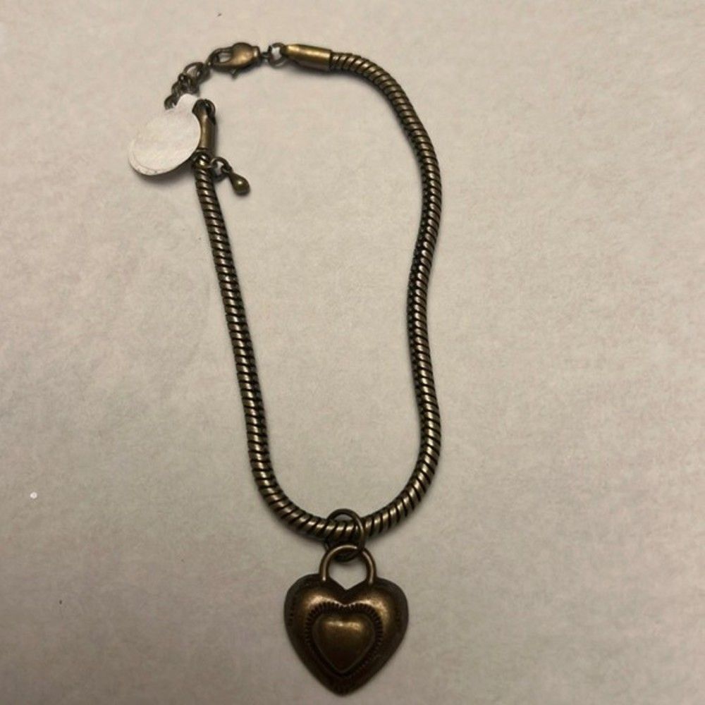 Handcrafted antique gold tone heart bracelet with built in extender.